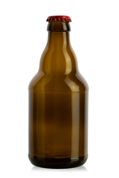Small brown empty beer bottle isolated on white background. File contains clipping path. - Fotoğraf, Görsel