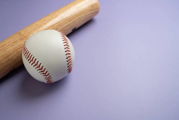 Close up baseball and baseball bat on purple table with copy space background, sport concept  - Valokuva, kuva