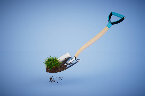 the concept of cultivating land in the garden. shovel with earth and grass on a blue background. 3D render. - Photo, Image