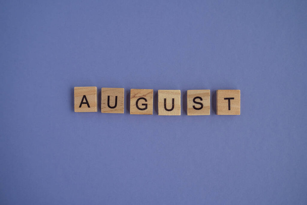Eighth month of the year August - from isolated letters on wooden blocks in natural color, in high resolution. Very Peri Color of the Year background, copy space. Flat lay, step by step, step 8. - Photo, image