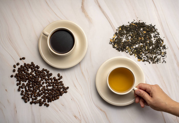 Food photography of  green tea, coffee, beans, choice, hand - Foto, afbeelding