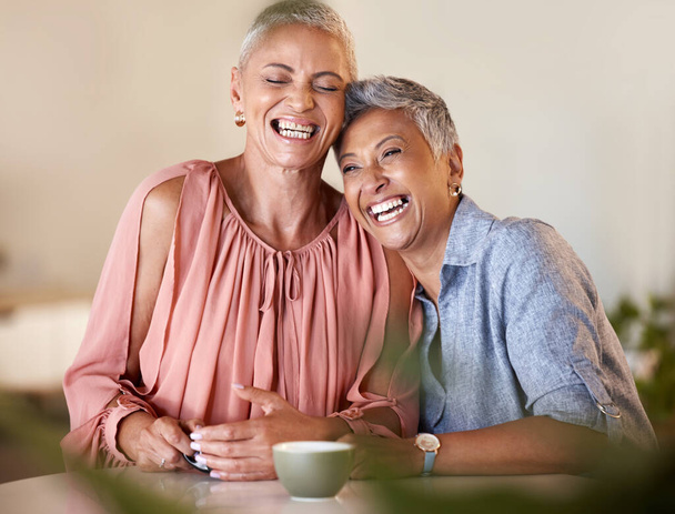Senior women, laughing and bonding with coffee in restaurant, Brazilian cafe or relax coffee shop with funny joke, gossip news or comic meme. Smile, happy and retirement elderly friends with tea cup. - Фото, зображення