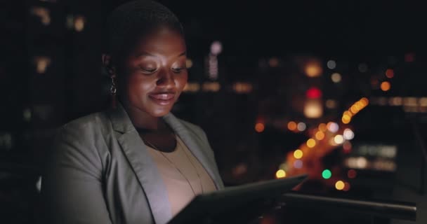 Corporate black woman, tablet and office in night, rooftop and social media for data analysis. Digital marketing planning, dark city and focus on mobile tech for goals, ux and analytics at company. - Footage, Video