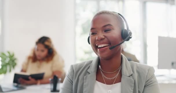 Face, black woman and customer service worker in call center laughing at funny joke while consulting. Telemarketing, comic and happy female sales agent, consultant or telemarketer talking in office - Footage, Video