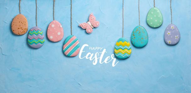 Banner for the Easter holiday. Egg-shaped cookies placed in an egg tray. Easter holiday concept. Place for text. Top view. - Photo, Image