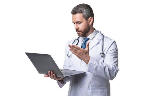 doctor presenting ehealth on background. photo of ehealth and doctor man with laptop. doctor promoting ehealth isolated on white. doctor offering ehealth in studio. - Фото, изображение