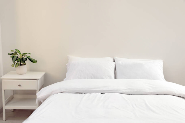 White soft pillows on cozy bed in room - Foto, imagen