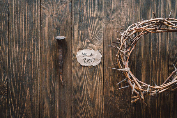 He is Risen. Jesus Crown Thorns and nails and cross on a wood background. Crucifixion Of Jesus Christ. Passion Of Jesus Christ. Concept for faith, spirituality and religion. Easter Day - 写真・画像