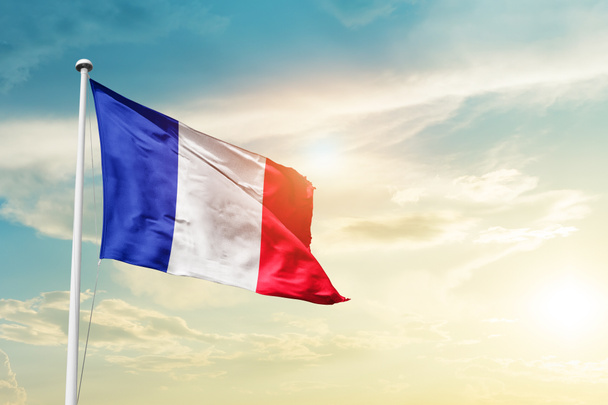 France waving flag in beautiful sky with sun - Zdjęcie, obraz