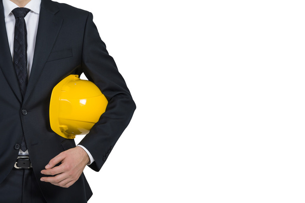 businessman engineer holding helmet - Foto, afbeelding