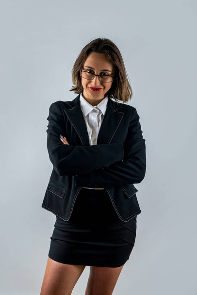 Portrait of happy smiling brunette businesswoman in black confident suit isolated over white background. Business studio concept. business woman boss - Valokuva, kuva