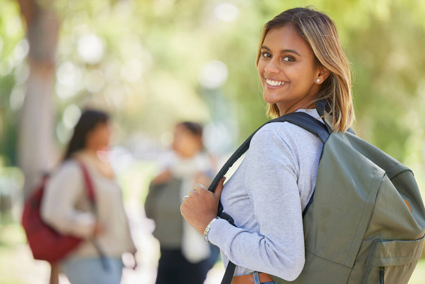 Education, scholarship or girl in university, college or back to school with a happy smile excited for learning on campus. Portrait, future or Indian student with motivation, knowledge or study goals. - Foto, Imagen