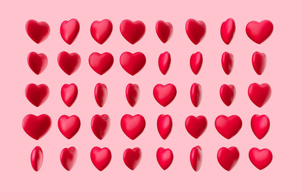 3d γυαλιστερό κόκκινο χρωματιστά καραμέλες καρδιά απομονώνονται σε κοράλλι φόντο, 3d εικονογράφηση - Φωτογραφία, εικόνα
