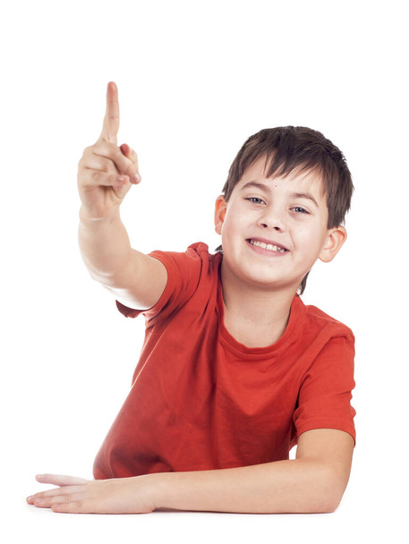Portrait of a boy raising his arms against a white background - Zdjęcie, obraz