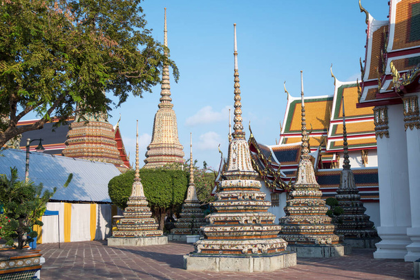 Beautiful chedi in the Wat Pho, Bangkok. It is one of the oldest and largest temples in Bangkok features the famous Reclining Buddha - Photo, image