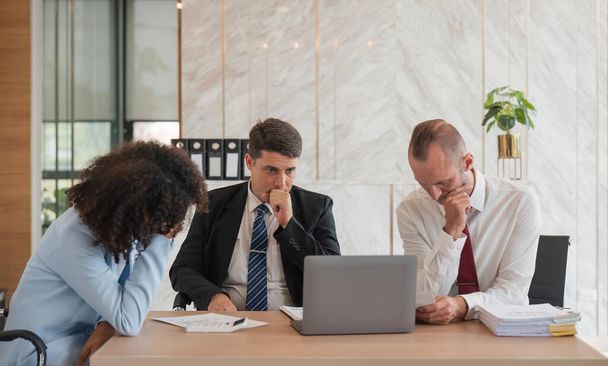 Stressed overwhelmed businesspeople feels tired at corporate meeting, exhausted businesspeople suffering from headache touching temples at team briefing, stress at meeting room. - 写真・画像