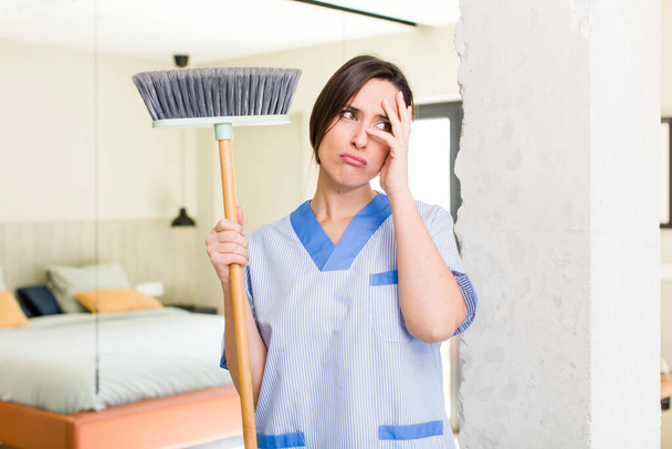 young pretty woman feeling bored, frustrated and sleepy after a tiresome. housekeeper concept - Fotoğraf, Görsel
