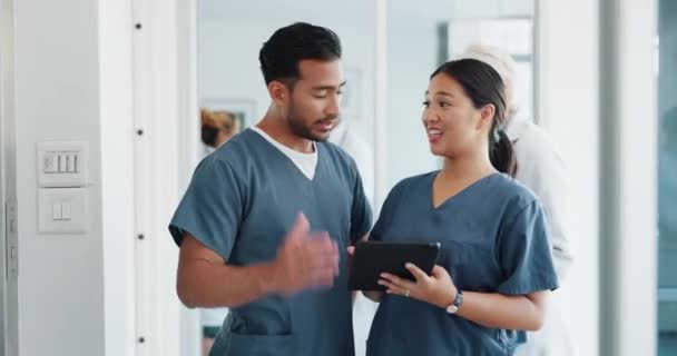 Doctor, team and tablet in discussion with senior for healthcare training, advise or support at hospital. Medical professionals with touchscreen in conversation, collaboration or teamwork at clinic. - Footage, Video