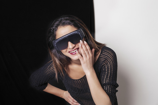 Beautiful woman wearing ski sunglasses and laughing - Foto, Imagem