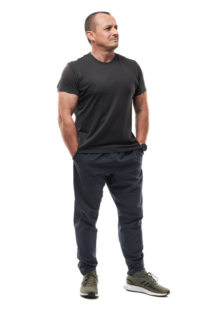 Full body of a mature fitness coach posing on white background - Photo, Image