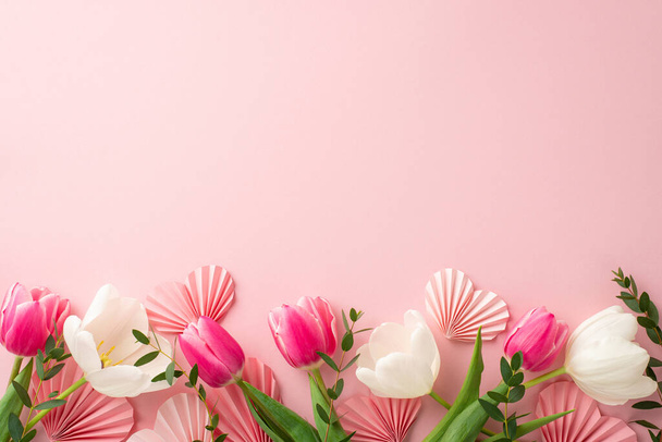 Mother's Day celebration concept. Top view photo of origami paper hearts pink and white tulips on isolated light pink background with copyspace - 写真・画像