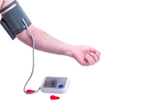 白い背景に隔離された腕の自動血圧モニター - 写真・画像