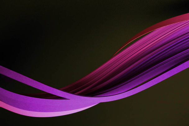 Neon pink violet color strip wave curve paper line on black. Abstract texture background. - Photo, image