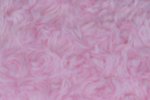 Laine de luxe rose texture naturelle pelucheuse de laine de fourrure utilisation en gros plan pour le fond et le papier peint - Photo, image