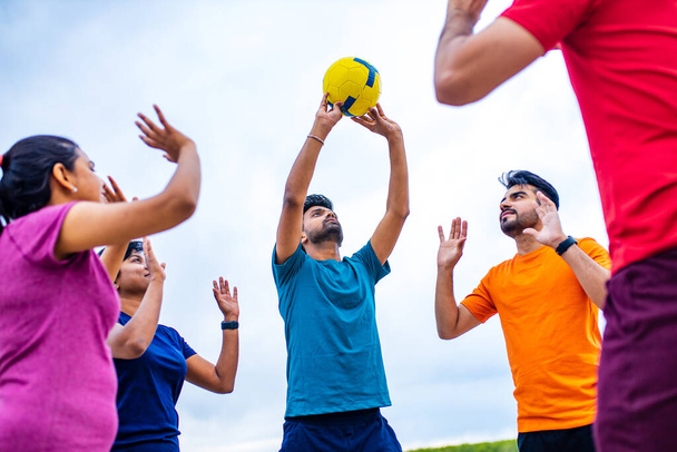 multiethnic team group playing beach volley. - Фото, изображение
