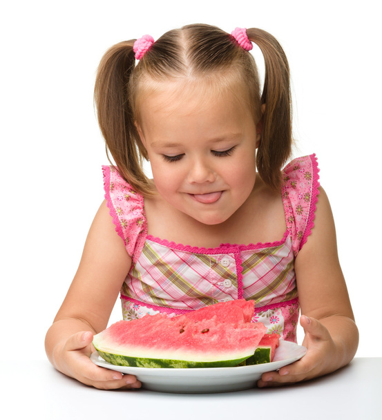 Cute little girl is going to eat watermelon - Fotoğraf, Görsel