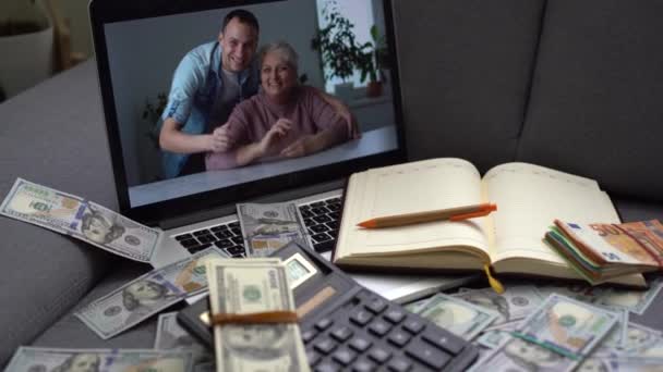 dollars and laptop with online chat. - Footage, Video