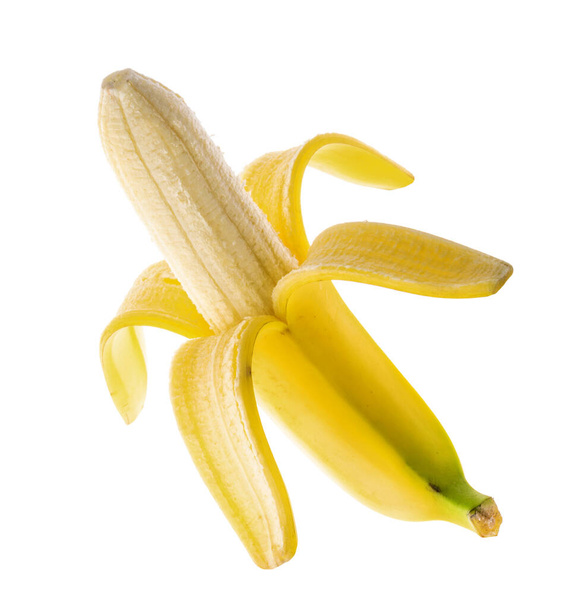 半分皮をむいた熟したバナナ,クリッピングパスと白の背景に隔離された - 写真・画像