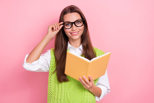 Photo of young woman positive stylish wearing classic vest librarian outfit reading book touch specs smart person isolated on pink color background. - Фото, зображення