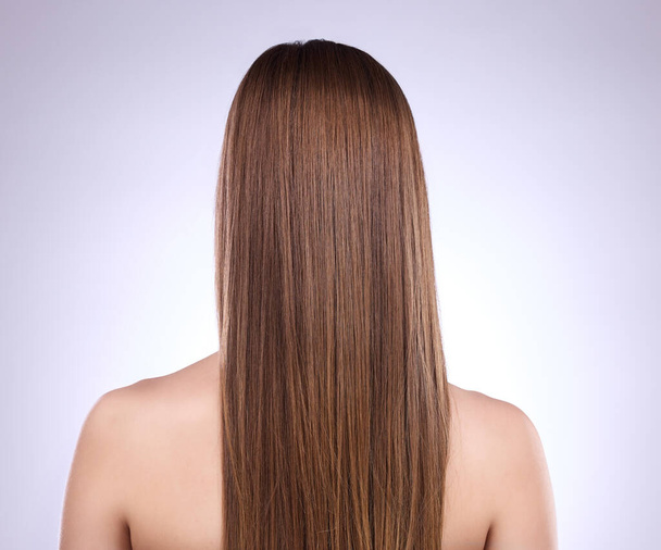 Beauty, back and haircare of woman in studio isolated on a gray background. Texture, cosmetics and female model with salon treatment for healthy keratin, balayage or hairstyle growth or straight hair. - Foto, immagini