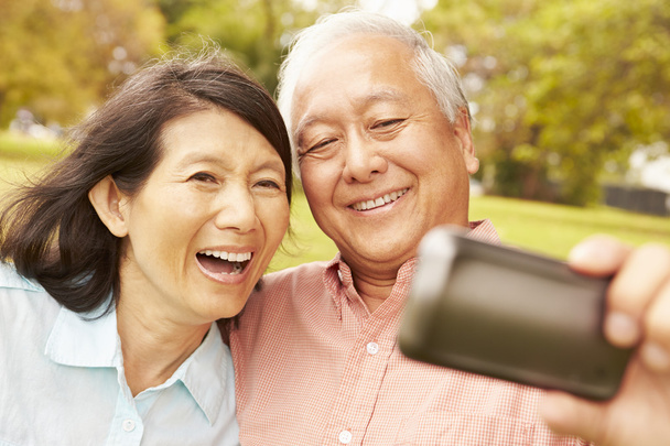 Senior Asian Couple Taking Selfie - 写真・画像