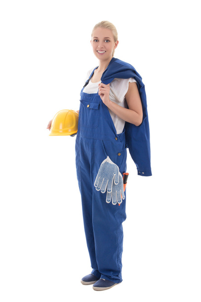 beautiful woman in blue builder uniform holding yellow helmet is - Photo, Image