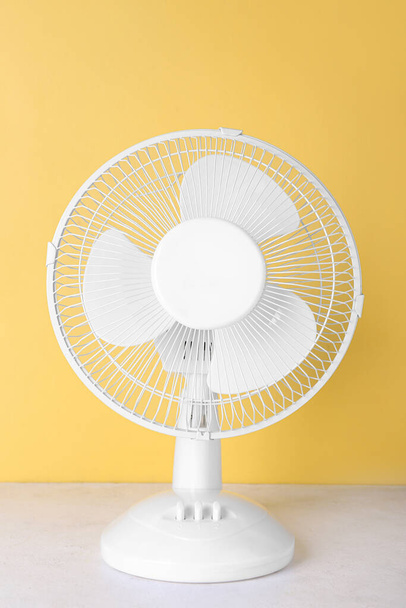 Electric fan on yellow background - Photo, Image