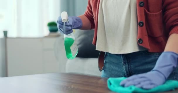 Spray, hands and woman cleaning table, furniture surface and housekeeping maintenance at home. Closeup cleaner wipe table with cloth, detergent and chemical bottle for dust, bacteria and disinfection. - Materiaali, video