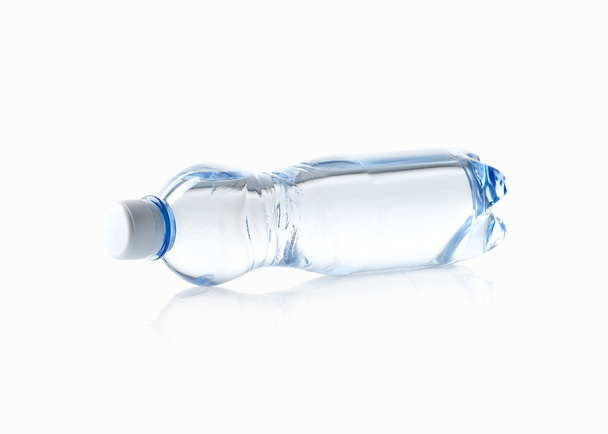 Water. Small plastic water bottle on white background - Φωτογραφία, εικόνα