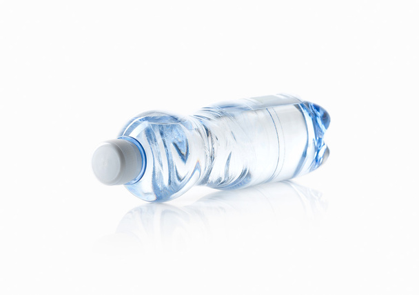 Water. Small plastic water bottle on white background - Photo, Image