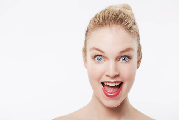 What A cosmetics sale. Portrait of a happy model against a white background - Fotó, kép