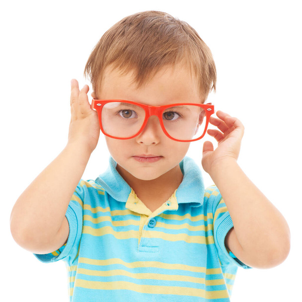Like my new specs. Studio portrait of a cute young boy wearing glasses isolated on white - Foto, afbeelding