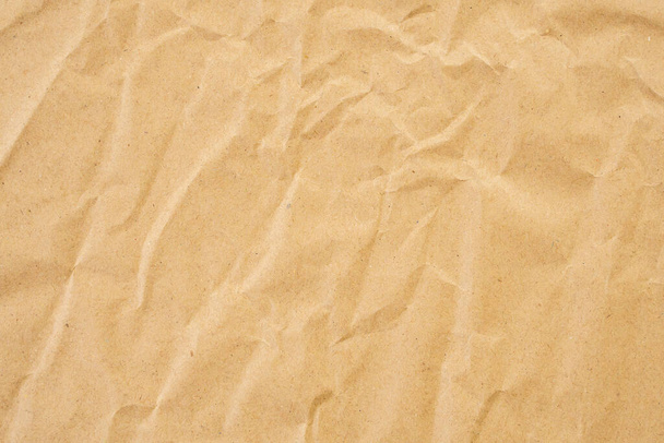 Abstract brown crumpled creased recycle paper texture background - Fotó, kép
