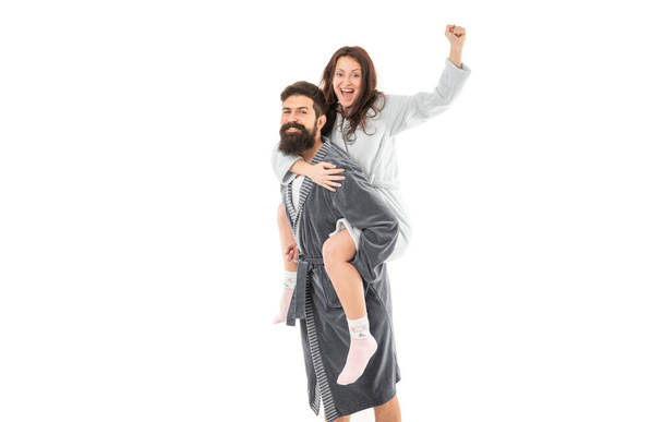 Happy woman enjoy riding piggy-back on man in morning isolated on white, fun. - Foto, Imagen