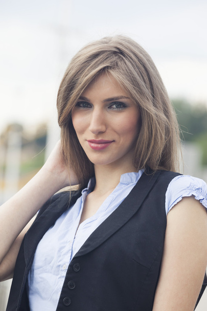 Beautiful woman in waistcoat and short sleeve shirt - Photo, image