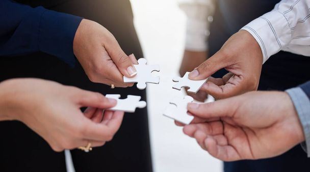 Team, hands and puzzle for teamwork, solution and integration, synergy and collaboration. Hand, business people and jigsaw for strategy, support and partnership, innovation and unity in cooperation. - Foto, Imagen