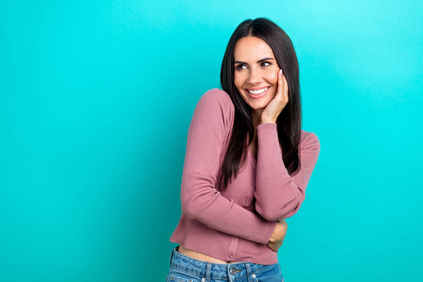 Portrait of positive adorable woman long hairstyle dressed pastel clothes look empty space isolated on shine turquoise color background. - 写真・画像