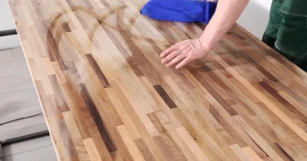 Cleaning table with damp oak table towel. Care of wooden products - Footage, Video