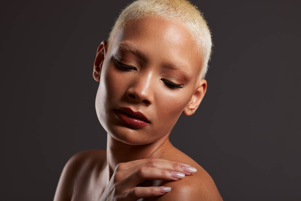 Beauty, makeup and face of black woman with eyes closed in dark studio with platinum hair isolated on grey background. Art aesthetic, cosmetics and beautiful African model with glowing skin facial - Foto, immagini