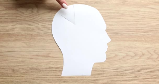 Hands picks up piece of brain with paper cutout. Autism memory loss and dementia - Footage, Video